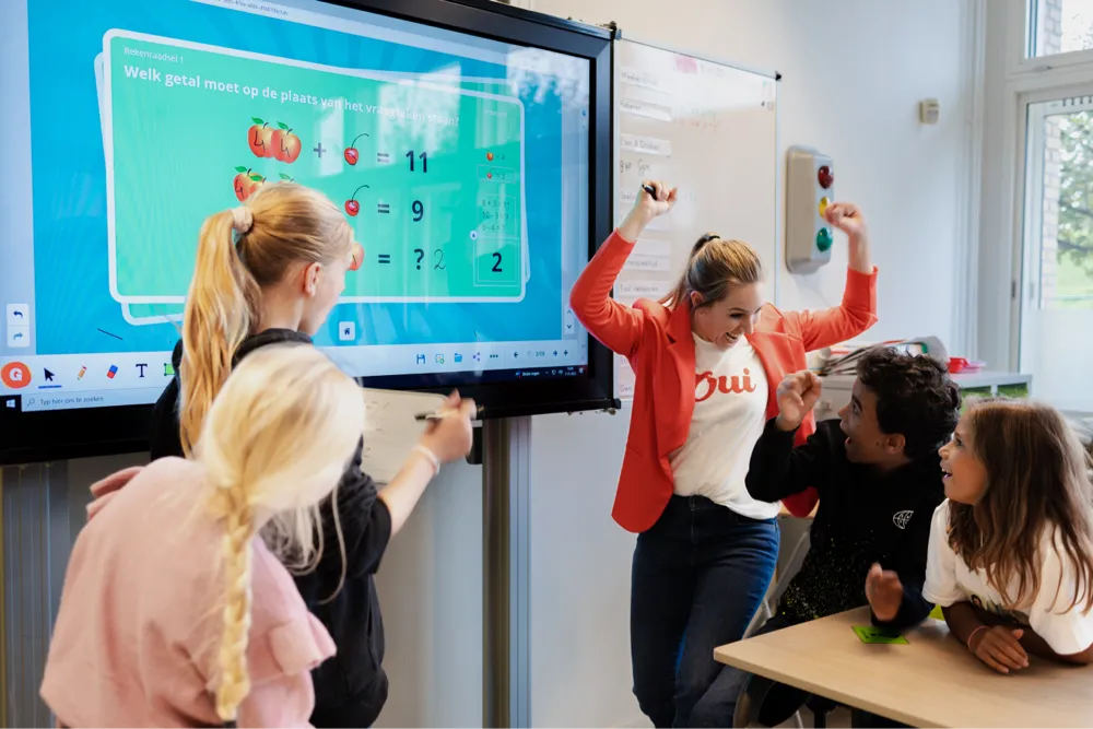 Teacher and students with interactive whiteboard