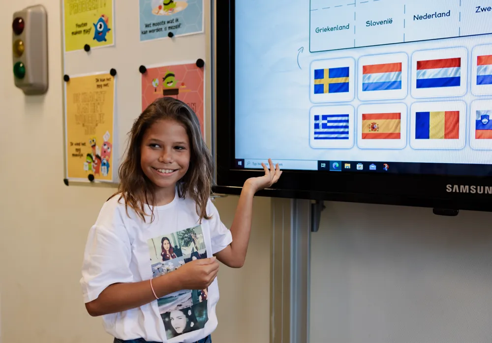 girl infront of whiteboard flags
