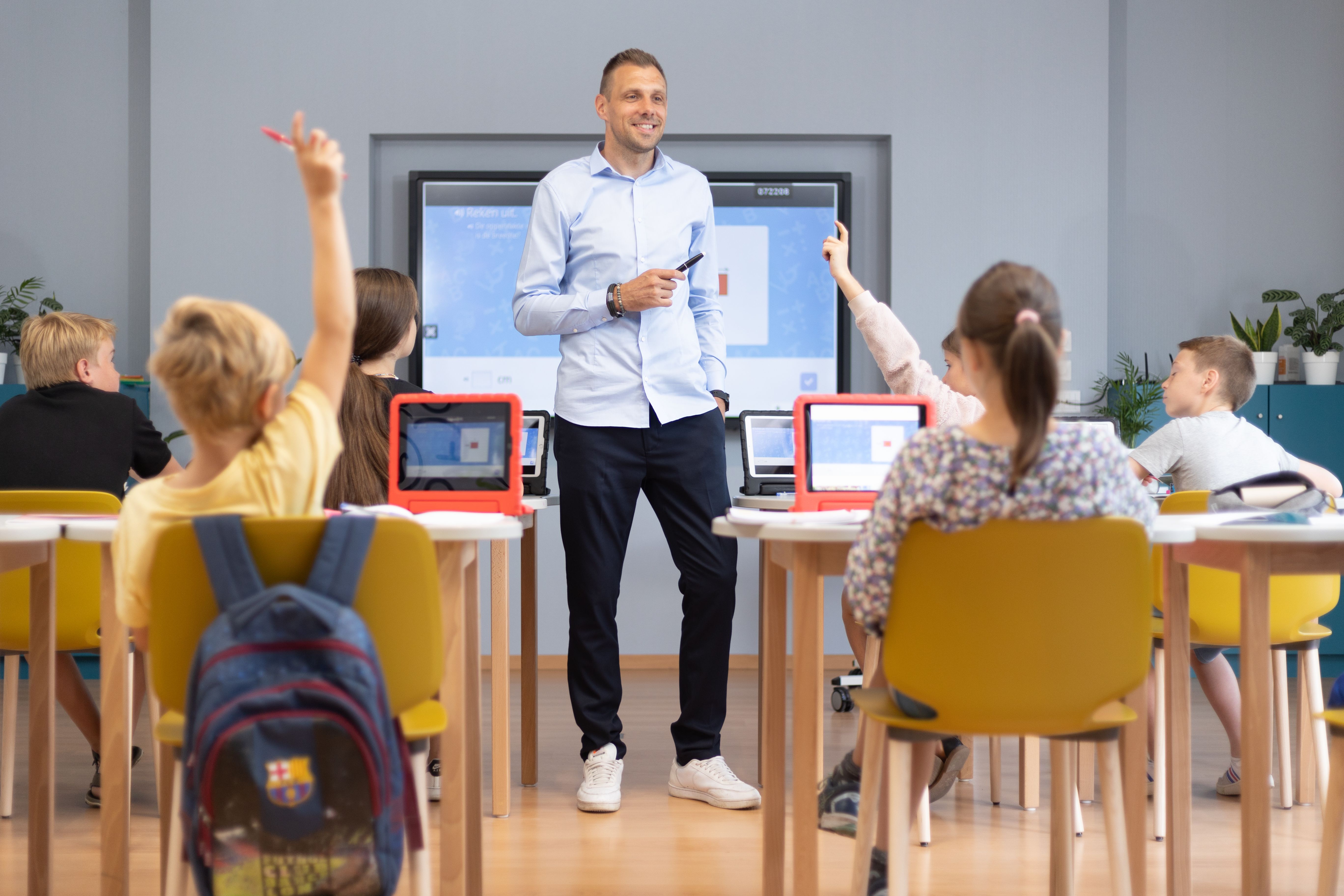 teacher standing in front of class